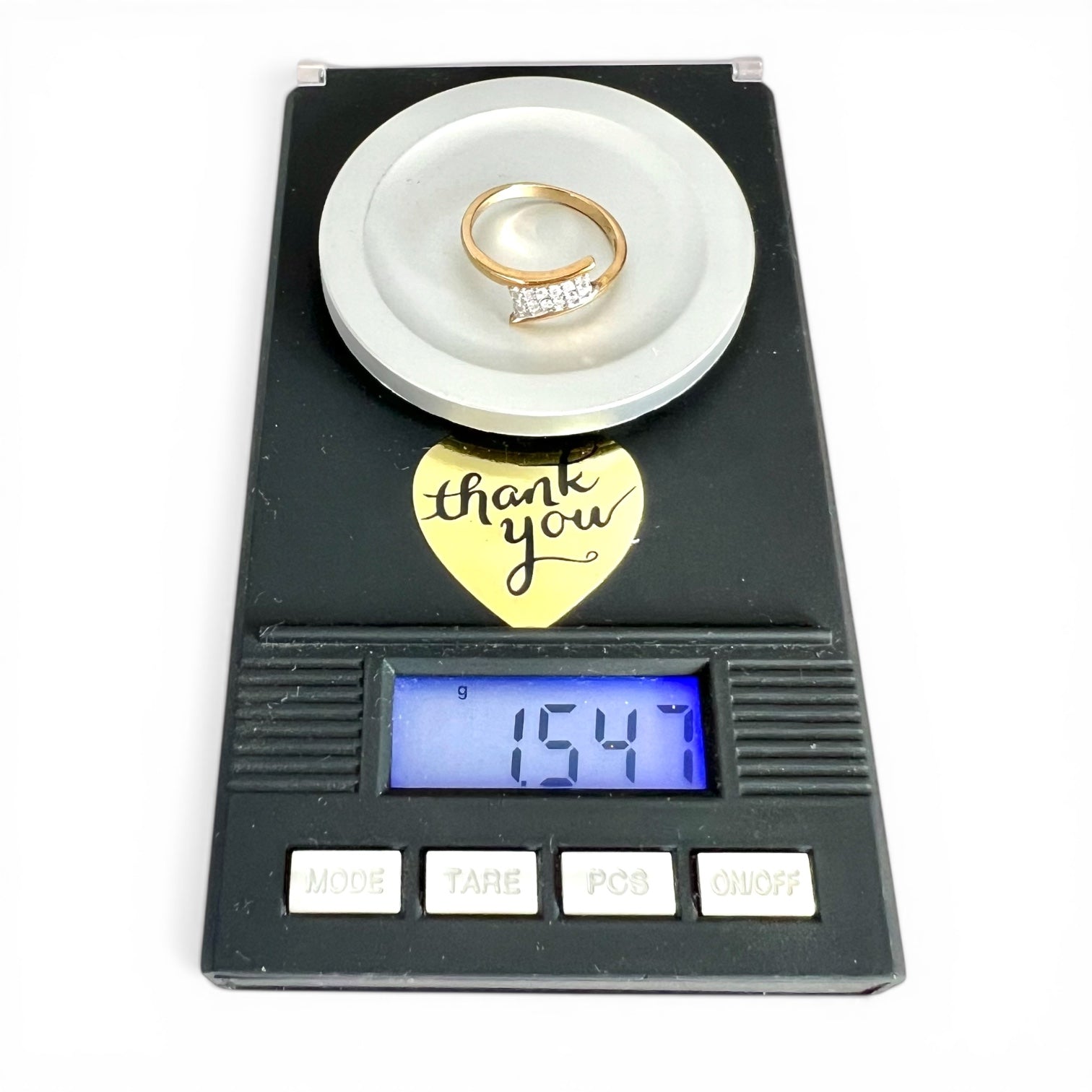 Weighing scales with rings on a white background