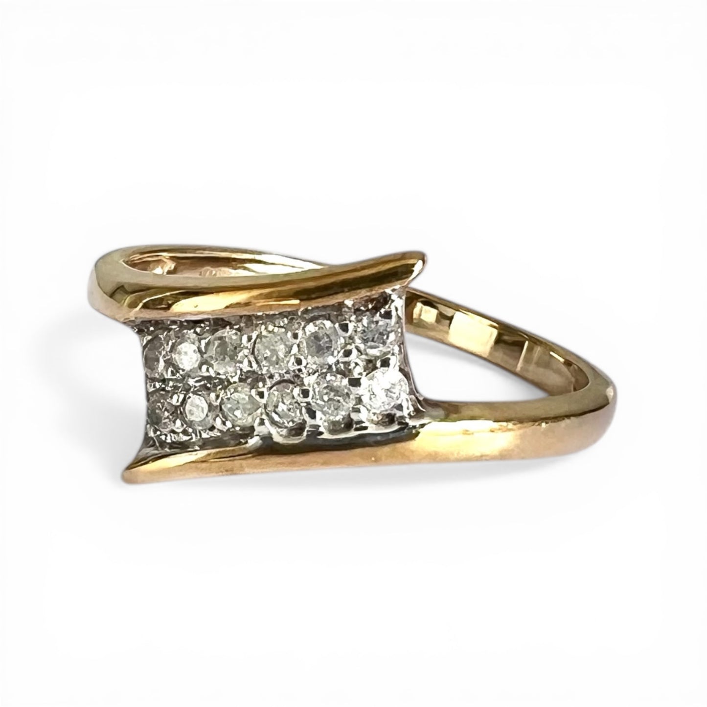 Gold ring with diamond accents on a white background