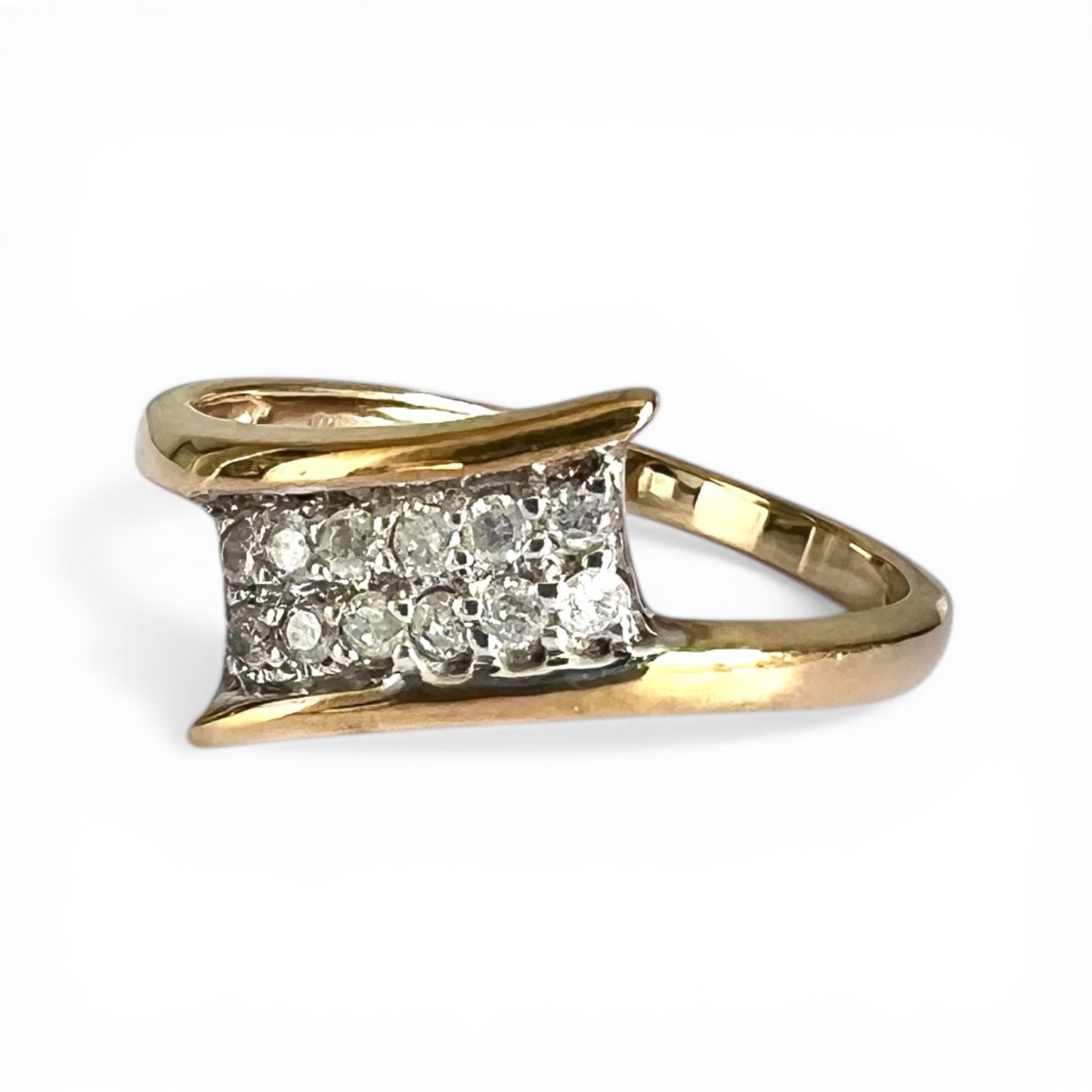 Gold ring with diamond accents on a white background