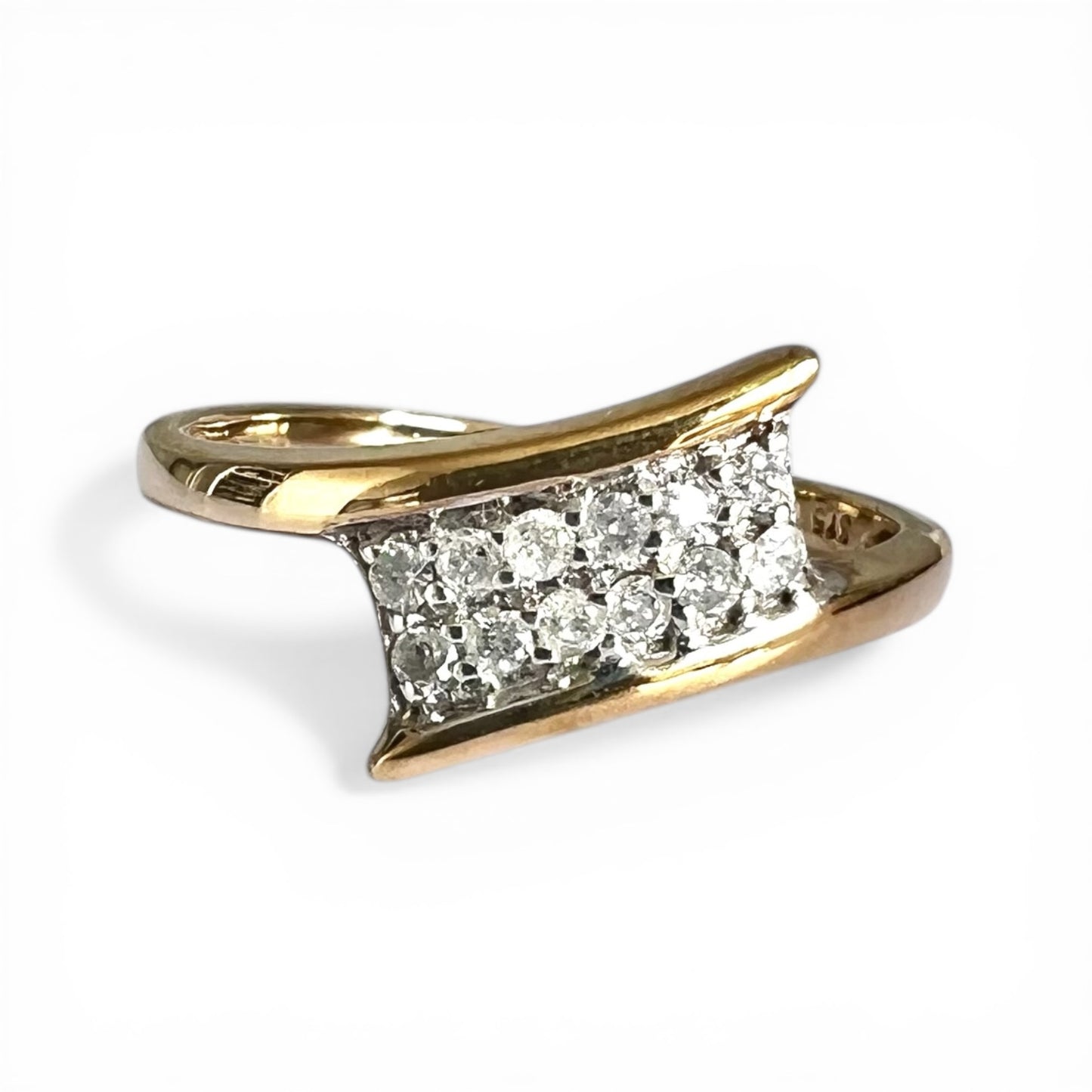 Gold ring with diamond stones on a white background