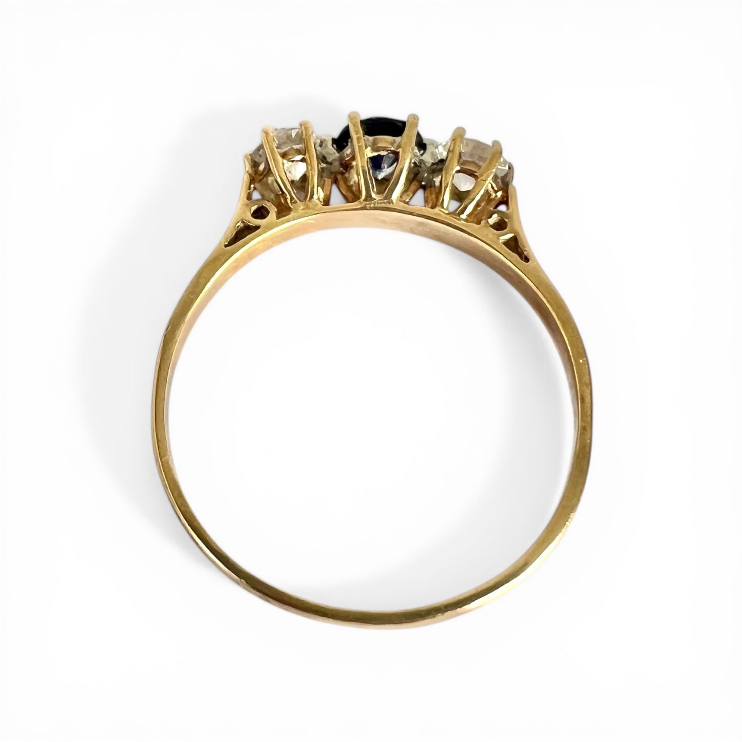 Top Down View Gold ring with gemstones on a white background